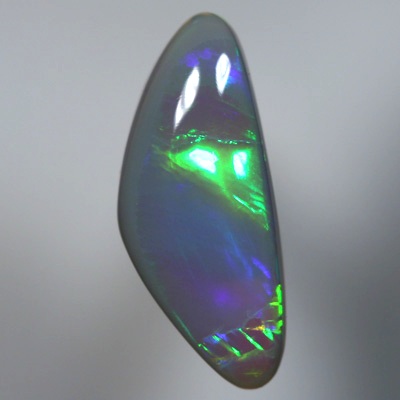 SOLID SEMI BLACK OPAL Large glassy rolling flashes, neon orange to green to purple